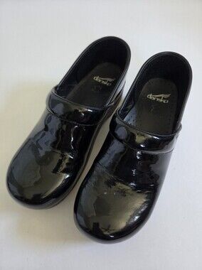 Like new! Dansko Professional clogs made with a black patent leather size 42